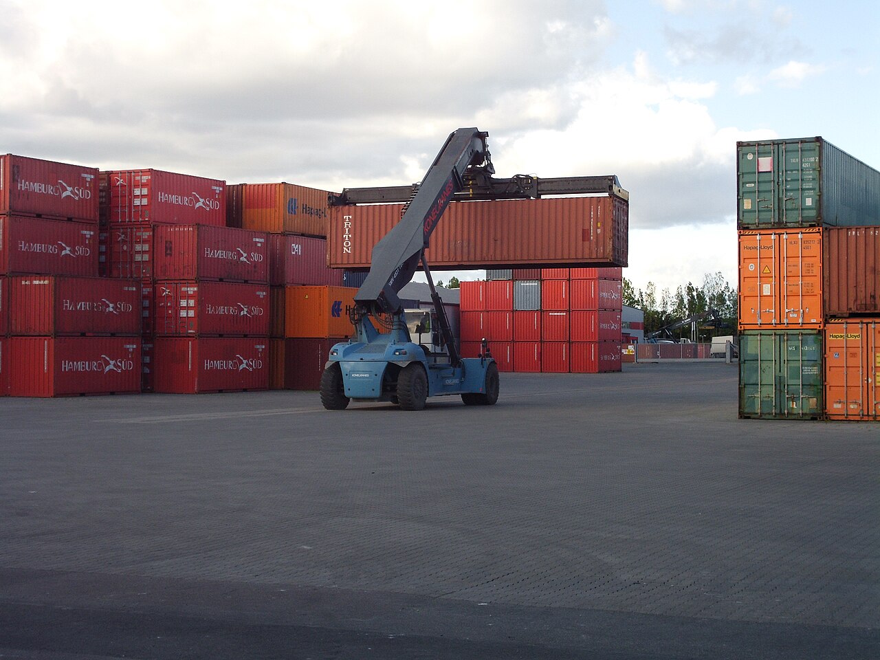 Shipping containers and a crane in a port terminal